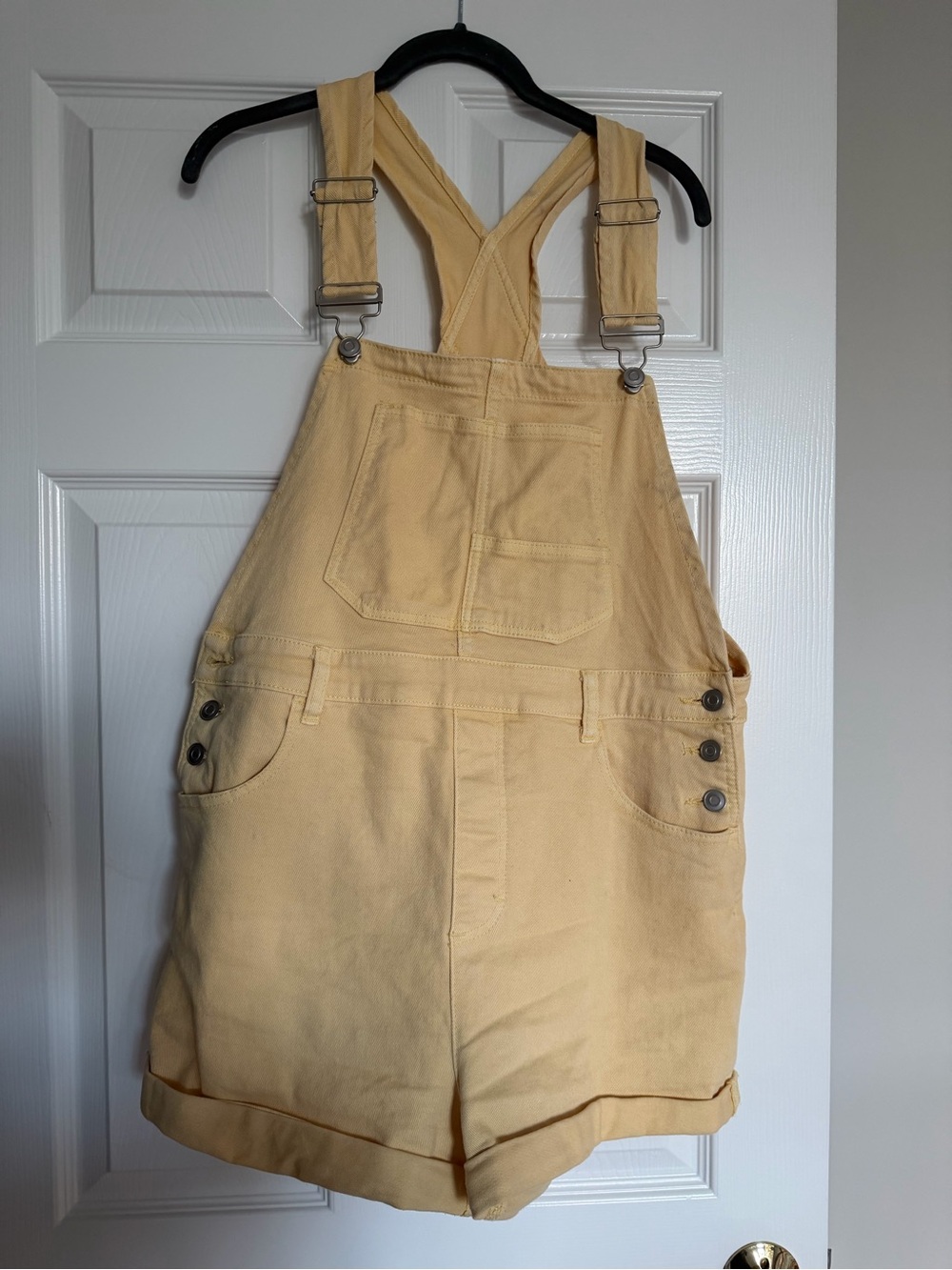 Altar'd State "Emara" denim shortalls in a beautiful, pastel butter yellow wash.